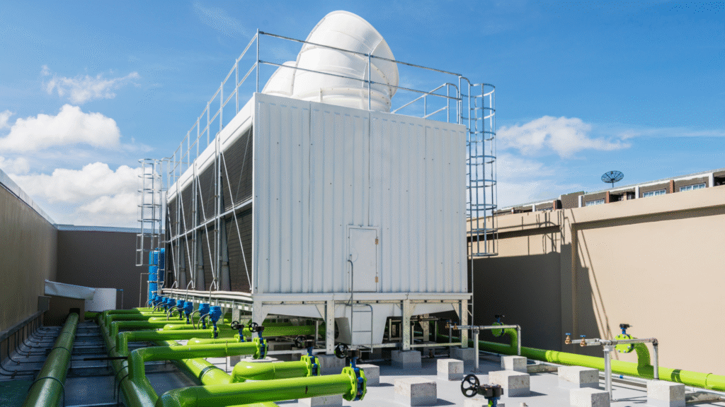 Hospital rooftop cooling tower system with visible piping, representing cooling tower compliance in healthcare facilities.