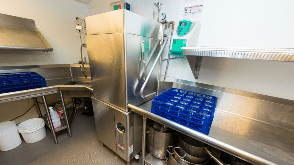 Stainless steel dishwashing unit representing clean in place systems in food and beverage processing