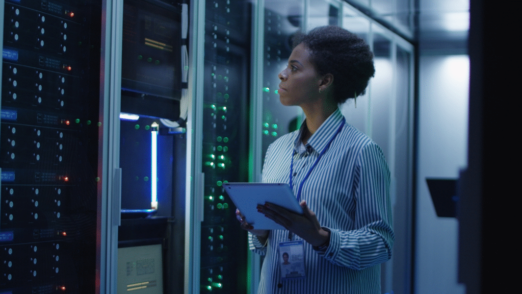 Engineer conducting water-linked system checks in a high-density data center to prevent failure.
