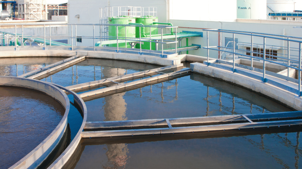 Industrial wastewater treatment process using clarifier tanks and filtration systems to separate suspended solids and improve effluent quality.