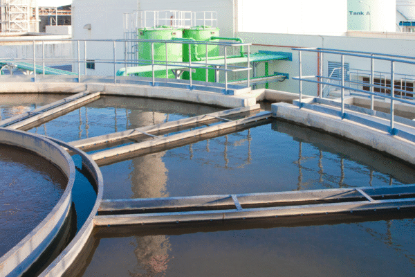 Industrial wastewater treatment process using clarifier tanks and filtration systems to separate suspended solids and improve effluent quality.