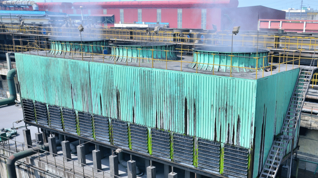 Industrial cooling tower drift eliminators capturing water droplets and minimizing drift in exhaust air