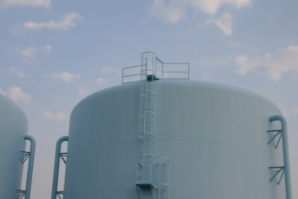 Industrial tanks used in a water softener vs filter system setup for improving industrial water efficiency.