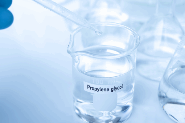 Laboratory beaker of propylene glycol for testing in ethylene glycol vs propylene glycol system comparison.